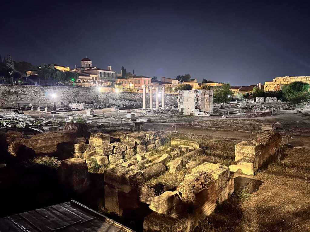 Hadrian's Library at nighttime view of the acropolis in the background