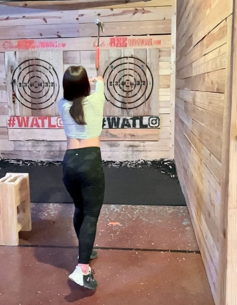 girl ax throwing in Austin Texas