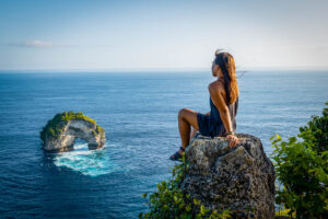 nomadicated posing on front of banah cliff archway