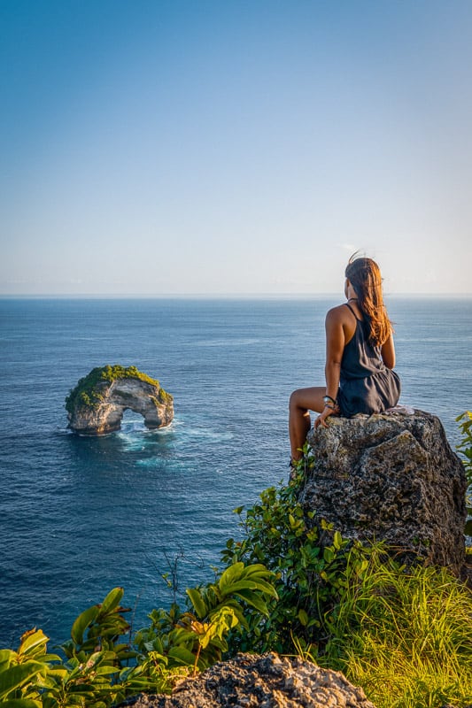 nomadicated posing on front of banah cliff archway