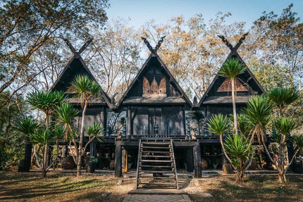 black building triple treehouse