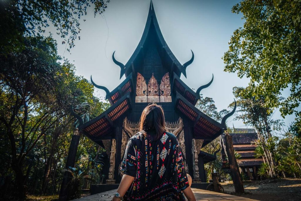 nomadicated in front of temple of Baan Dam Museum