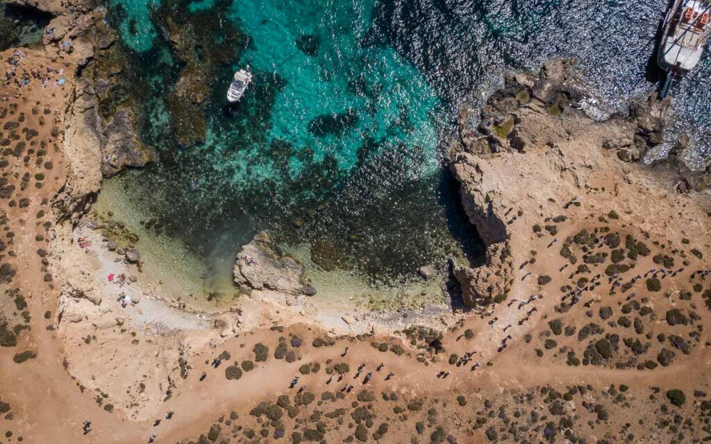 birds eye view of crystal lagoon of comino island