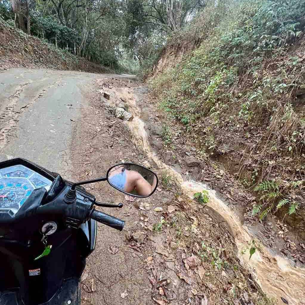 Flooded road on street with scooter when raining