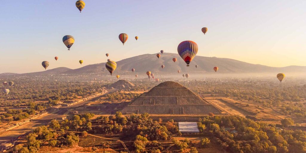 Sunrise on hot air balloon over the Teotihuacan pyramid