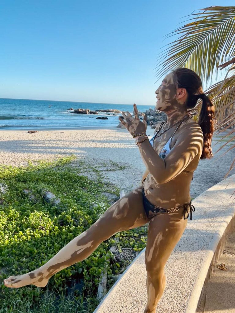 Girl covered in mud in Bocana beach