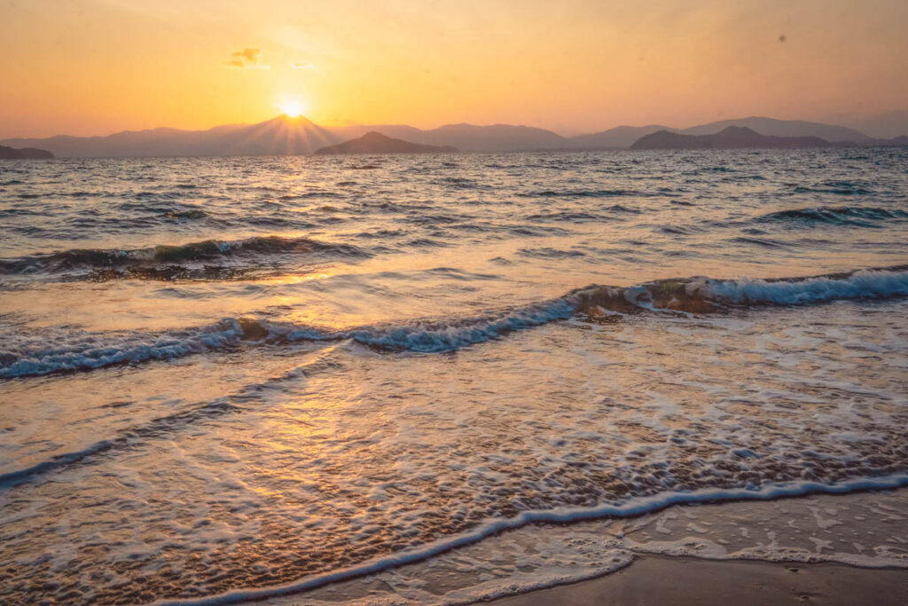 Golden hour reflections on the calm waters of Aow Kao Kwai Bay