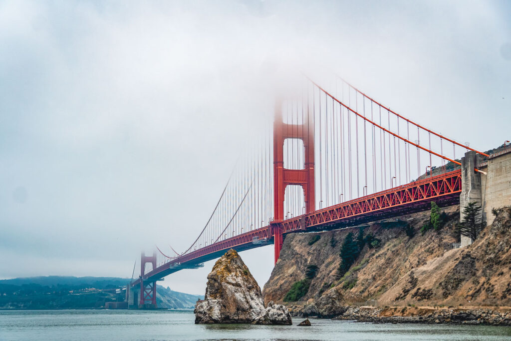 golden gate bridge in the fog at lands end