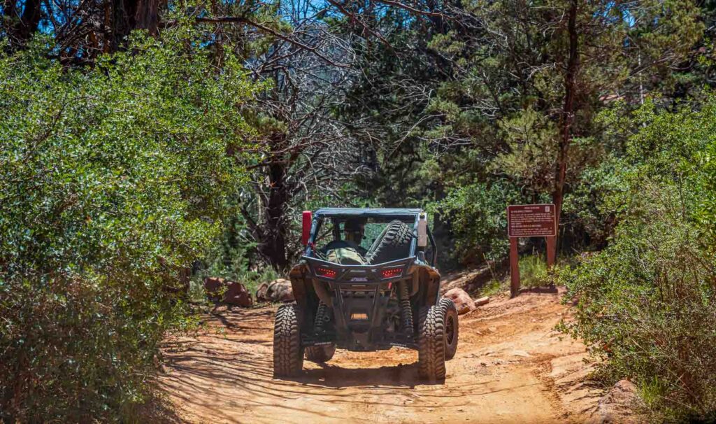 4 wheel drive car off road on red orange rocks in Sedona