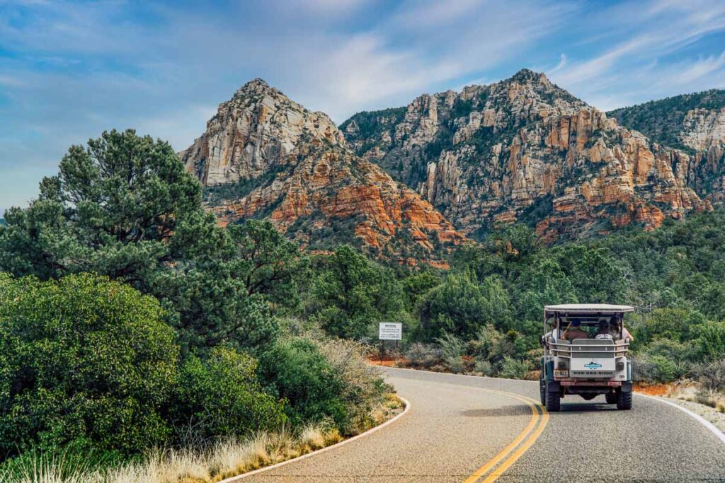 A Jeep tour driving into Sedona's red rock mountains