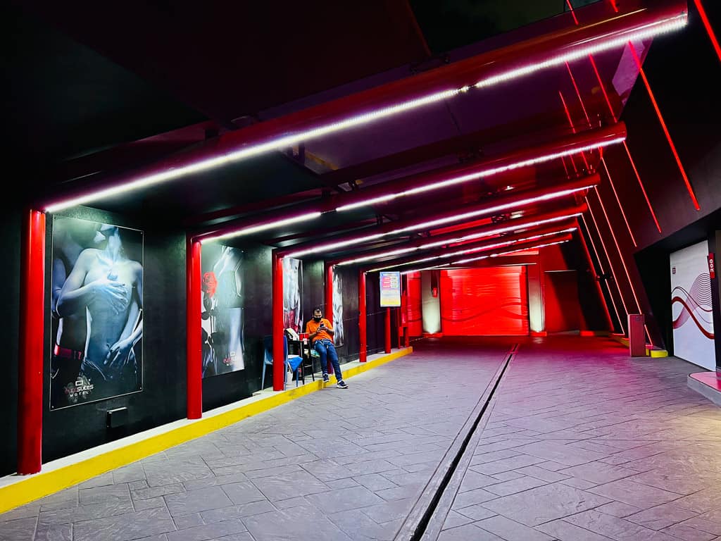 Red reception area with murals