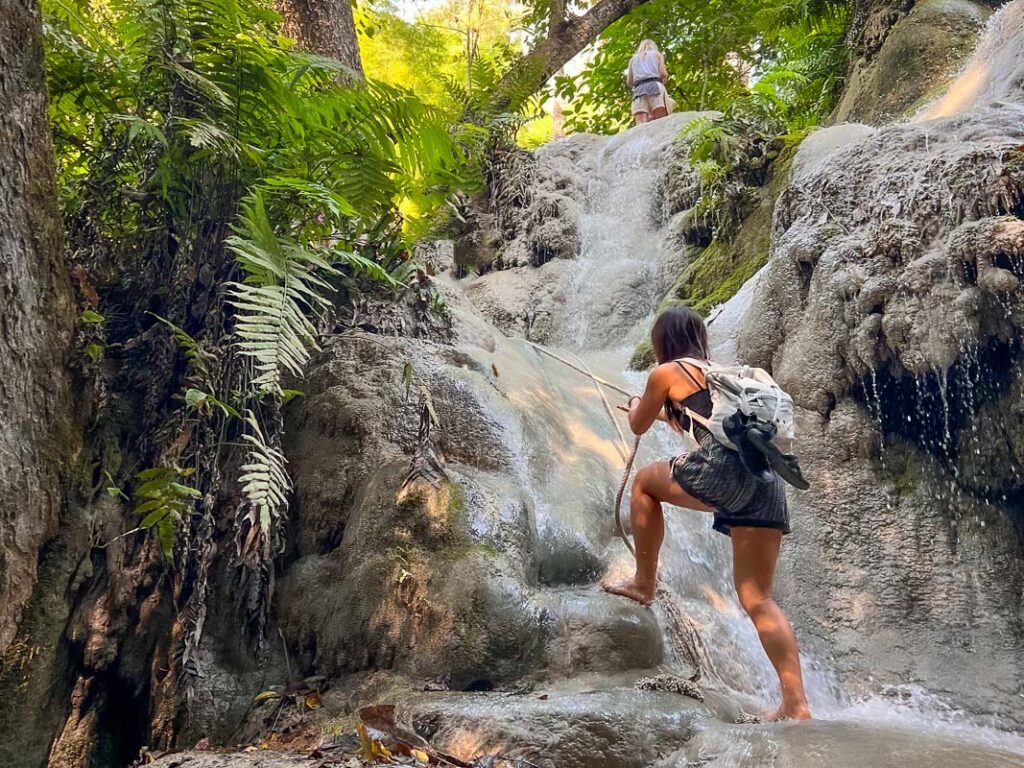 Nomadicated climbing up the side of sticky waterfalls