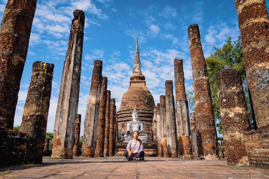 nomadicated sitting in front of Wat Sa Si a photogenic temple in the central historical park