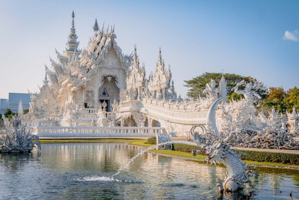 white temple side pond view