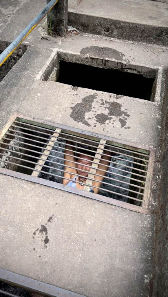 nomadictaed sliding down bridge drain, one of the funnest things to do in lombok