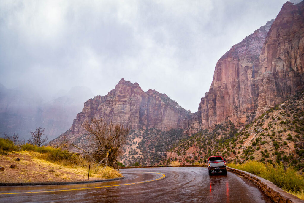 driving through the cliffs of zion on a bus tour from las vegas