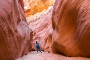 Nomadicated posing in front of colorful Antelope Canyon walls Page